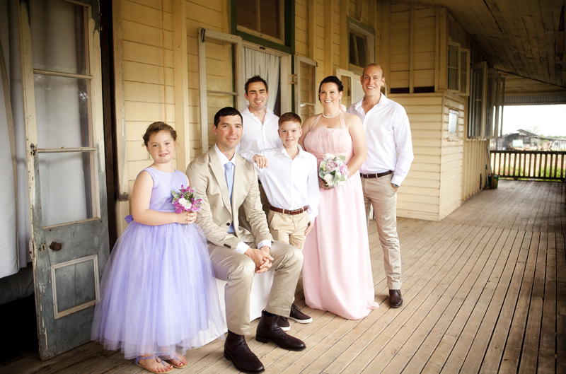groomsman with wedding party at rural building, Clermont