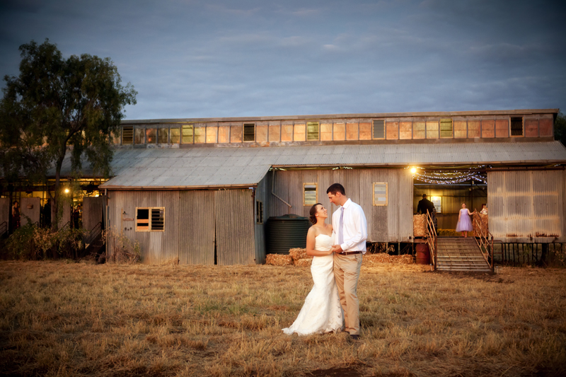 bride and groom in front of wool shed, Queensland