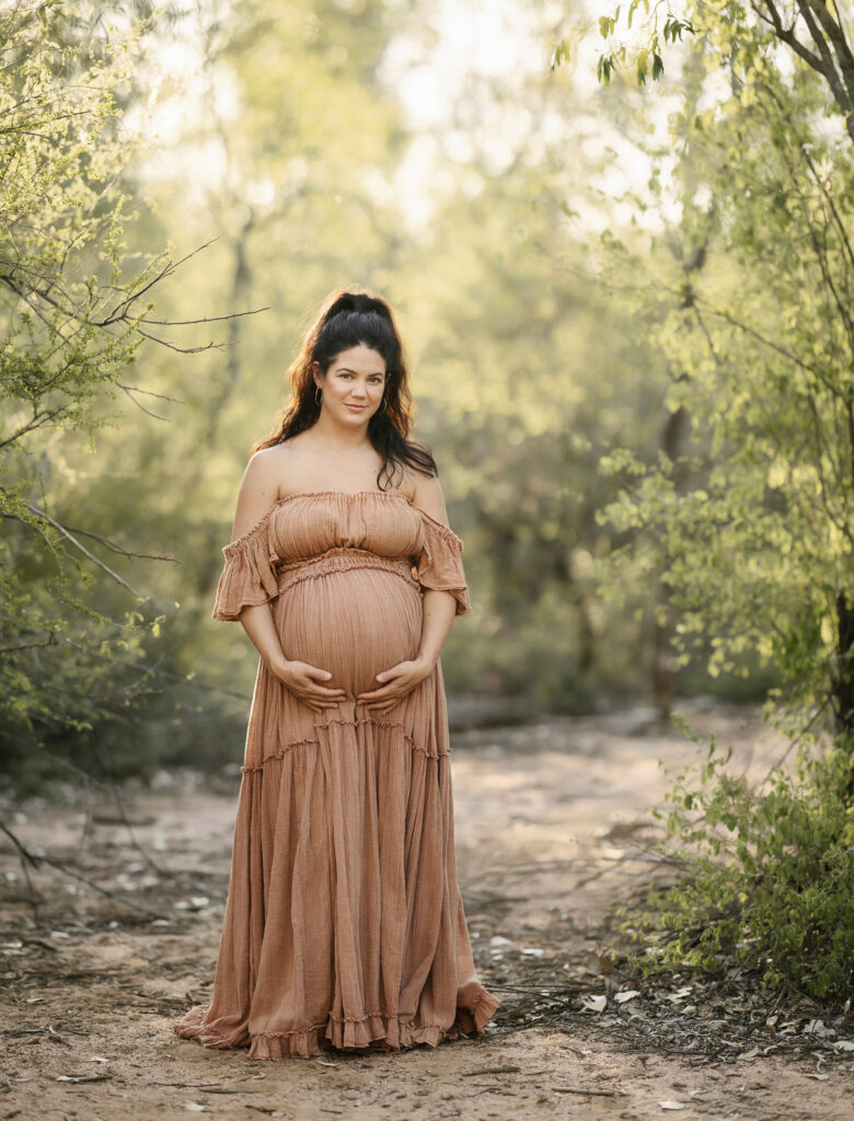 Bethany's pregnancy portrait among native trees on a rural property