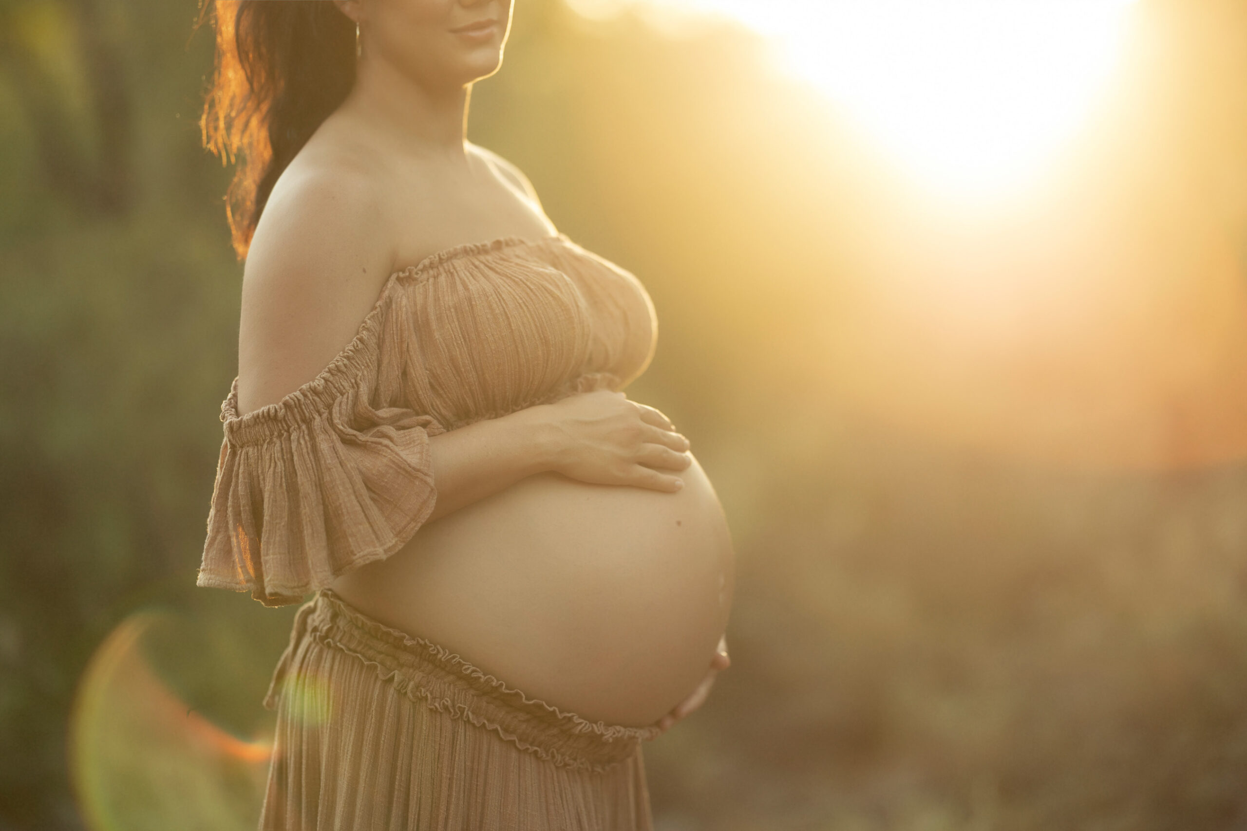 glowing sunset shot of pregnant women, maternity photos