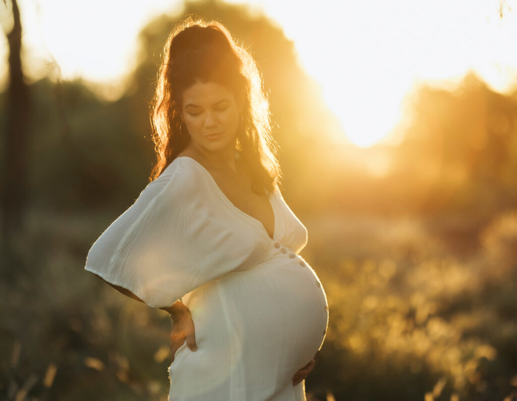Maternity photography near Comet with warm backlighting