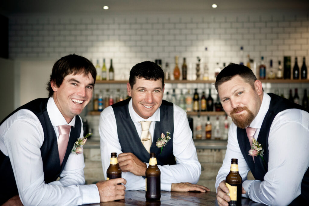 groomsmen having a relaxing beer together