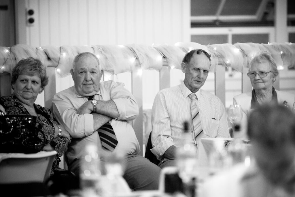 Wedding guests watching the speeches